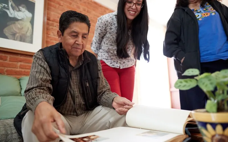 a family looks through their photo album